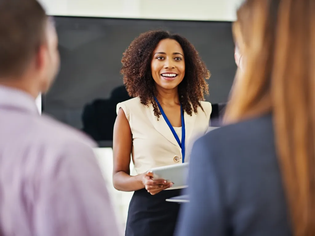 Technical consultants strategizing on a whiteboard for business growth